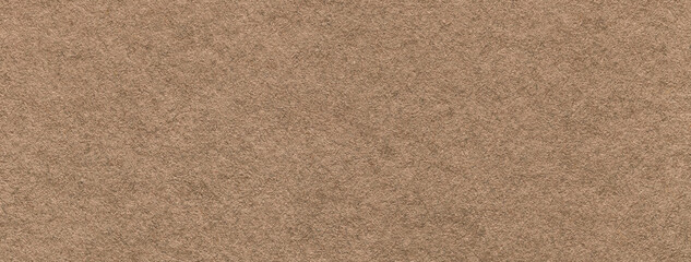 Texture of craft brown paper background colors, macro. Structure of vintage kraft umber cardboard.
