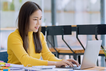 Happy asian young businesswoman using laptop at office workplace, Business owner people sme...