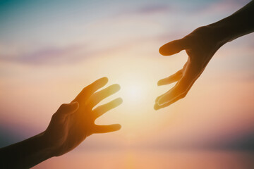 Giving a helping hand on sunset