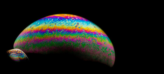 Rainbow-colored bubble against a dark backdrop