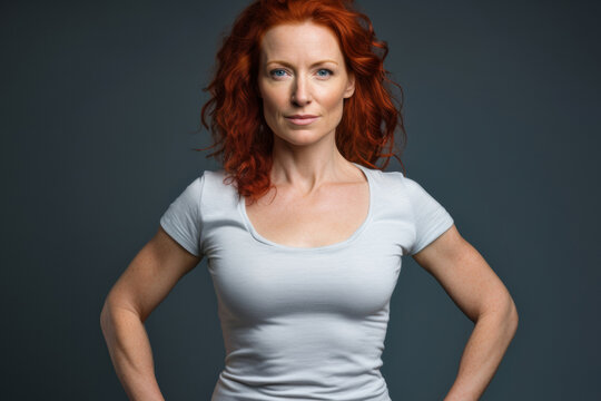 Confident Middle-aged Redhead Woman Empowering Fitness Lifestyle