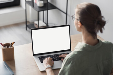 Woman working at home office, Student girl using laptop computer with blank empty screen, work or studying from home, freelance, online learning, distance education concept