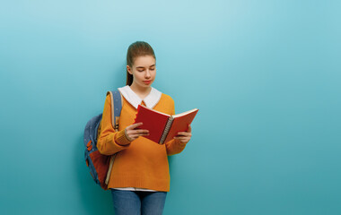 teenager on color paper wall background