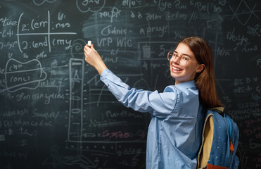 Teenager in class on background of blackboard