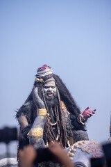 Masan Holi, Portrait of an male artist act as lord shiv with dry ash on face and body also in air...