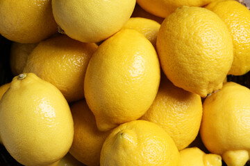 Many fresh lemons as background, top view