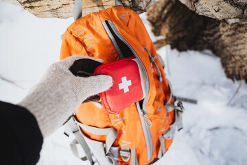 Winter Wilderness Red First Aid Kit for Snow-Covered Forest Camping