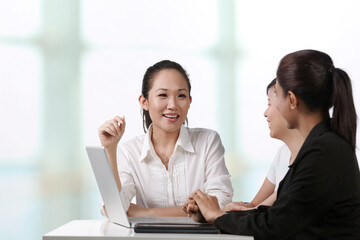 Asian business women having a meeting