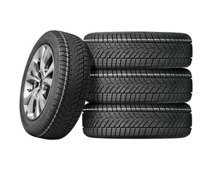 Car tires with a great profile in the car repair shop. Set of summer or winter tyres in front of...