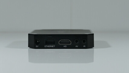 The back panel of a set top box with different connectors and slots for connection
