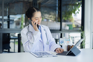 Professional medical doctors woman using smartphone in hospital office. Medicine, healthcare and...