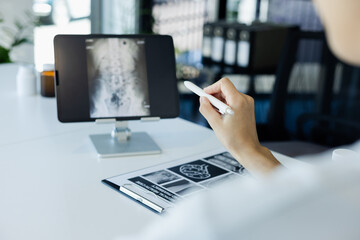 doctor working on a computer.