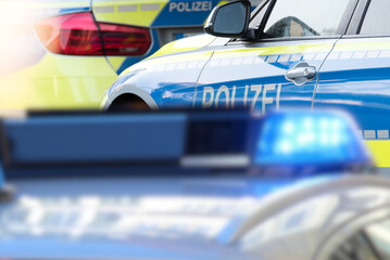 Blaulicht und Polizeiautos in Deutschland - obrazy, fototapety, plakaty