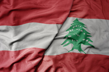 big waving national colorful flag of lebanon and national flag of austria .