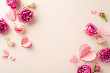 International Women's Day setup. Top view of delicate paper hearts, and fresh rose buds on a gentle beige canvas, providing space for text or promotional content