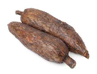 Two whole ripe cassava roots isolated on white
