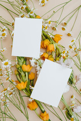 Blank paper sheet cards with mockup copy space on orange and white flowers. Wedding invitation...