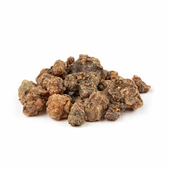 Pile of large pieces of myrrh resin on a white background.
