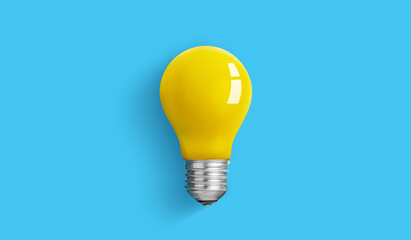 Yellow Light bulb on blue background