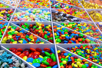 Various colorful candies in sweets shop at the market.