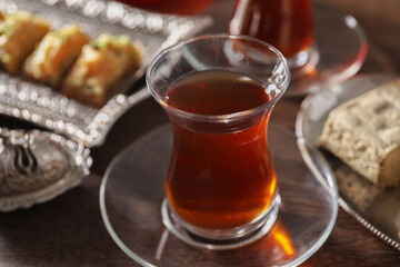 Traditional Turkish tea in glass on table, closeup