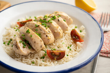 Chicken cooked with lemon and thyme over rice.