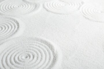 Zen rock garden. Circle patterns on white sand