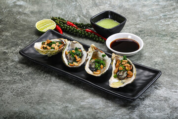 Open half oysters with green onion