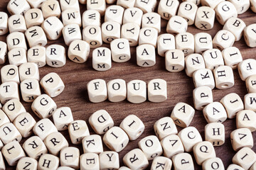 Number Four spelled out, letter dices word
