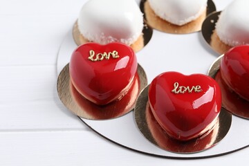St. Valentine's Day. Delicious heart shaped cakes on white wooden table