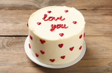 Bento cake with text Love You on wooden table. St. Valentine's day surprise