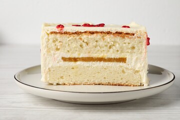 Cut bento cake on white wooden table, closeup. St. Valentine's day surprise