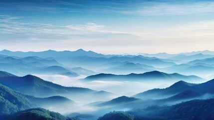 Obraz premium Ethereal mountain peaks enveloped in a soft, misty fog at dawn