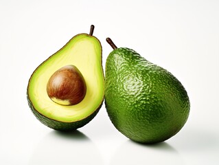 a avocado cut in half next to a whole avocado