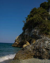 Fototapeta na wymiar The Greek sea ending up between some beautiful rocks.(Kostas Galanis)
