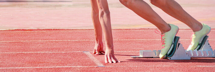 Cropped image of a sprinter getting ready to start at the stadium