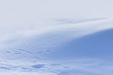 Winter landscape. snow-covered hill, pale blue whitish surface background - 734860140