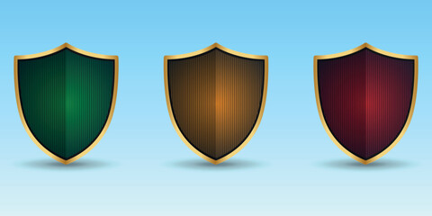 A set of three colored shields in a gold frame. 3D. Green, yellow and red. Vector 