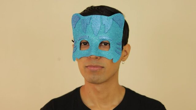 Latin young male disguised as PJ cartoon with a children's mask