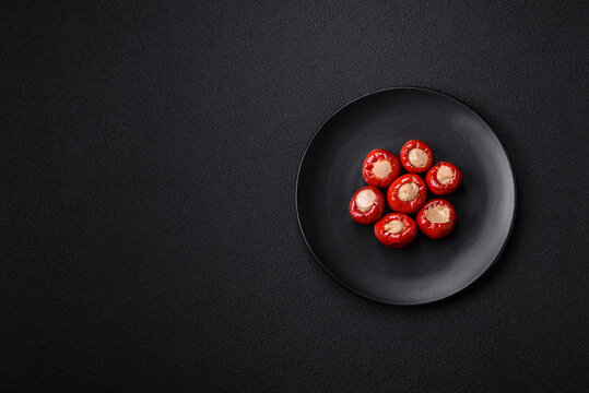 Red bell peppers stuffed with cheese or meat with salt, spices and herbs