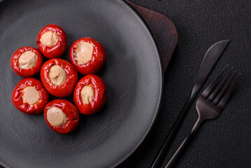 Red bell peppers stuffed with cheese or meat with salt, spices and herbs