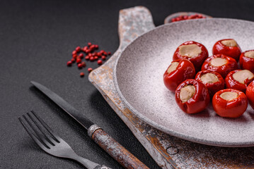 Red bell peppers stuffed with cheese or meat with salt, spices and herbs