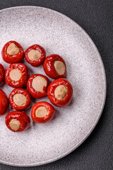 Red bell peppers stuffed with cheese or meat with salt, spices and herbs