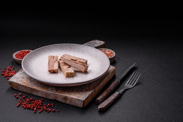 Delicious canned dietary tuna meat with salt, spices and oil