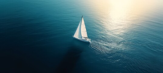 Aerial view of single sailing yacht with white sails on high seas, regatta sailboat with copy space - obrazy, fototapety, plakaty