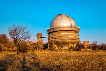 Astronomical Observatory Telescope at beautiful sunset. Armenia, Byurakan