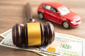 Hammer gavel judge and US dollar banknote money with car vehicle accident, insurance coverage claim...