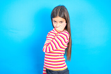 beautiful kid girl wearing  striped T -shirt with toothache