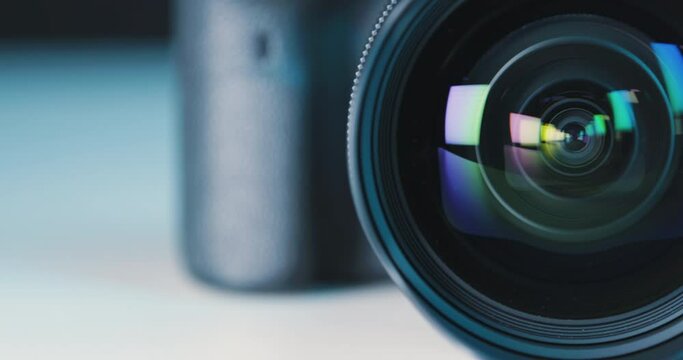 Colorful play of colors inside a lens of professional photo camera, close-up pan