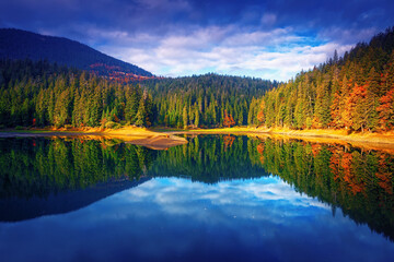 Autumn forest and mountain lake - 734899157
